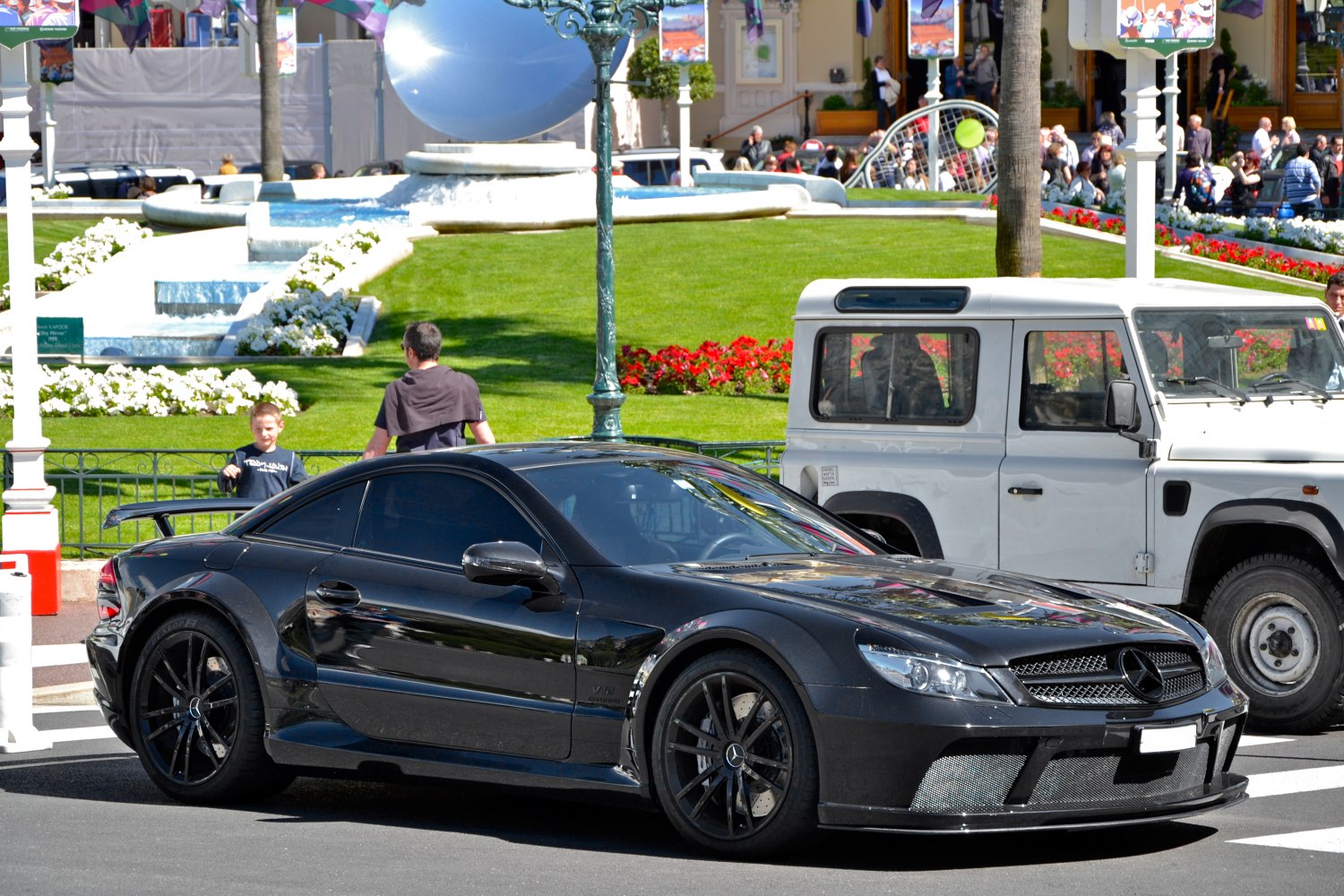 Black sport coupe with aerodynamic body and black alloy wheels