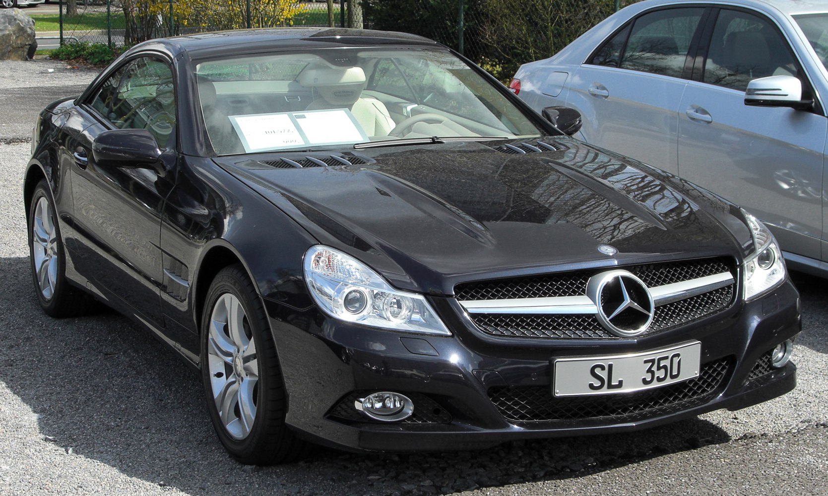 Front view of a luxury coupe with distinct grille and headlights