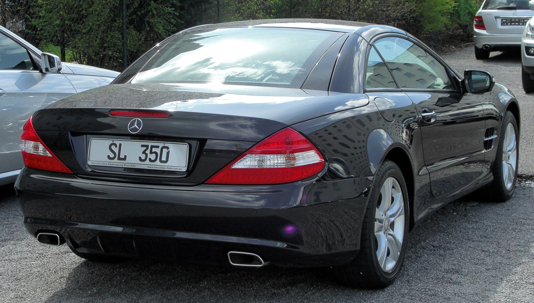 Rear view highlighting taillights and dual exhaust tips