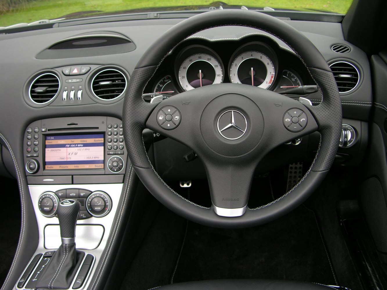 Dashboard and steering wheel of a luxury sports car interior
