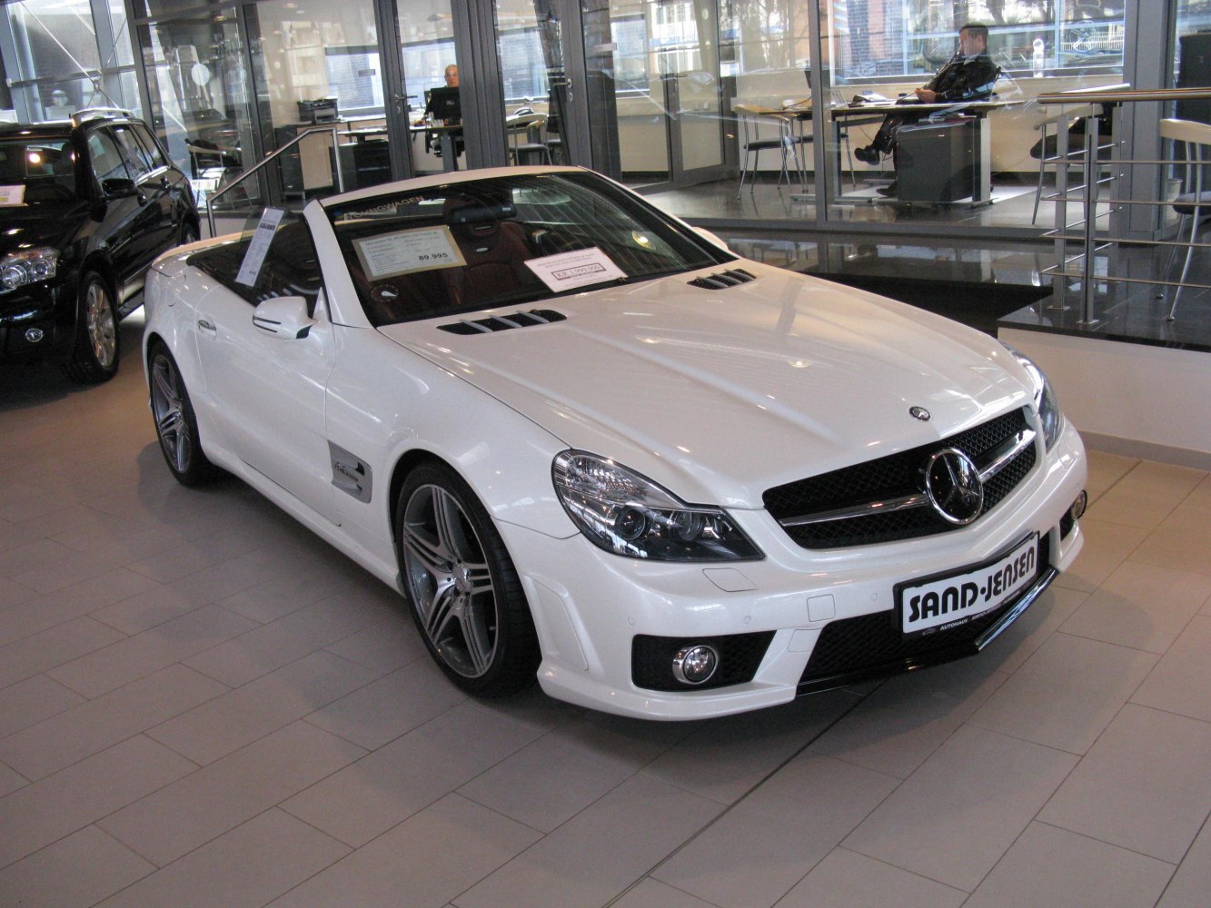 White convertible with AMG-style front grille and sporty rims
