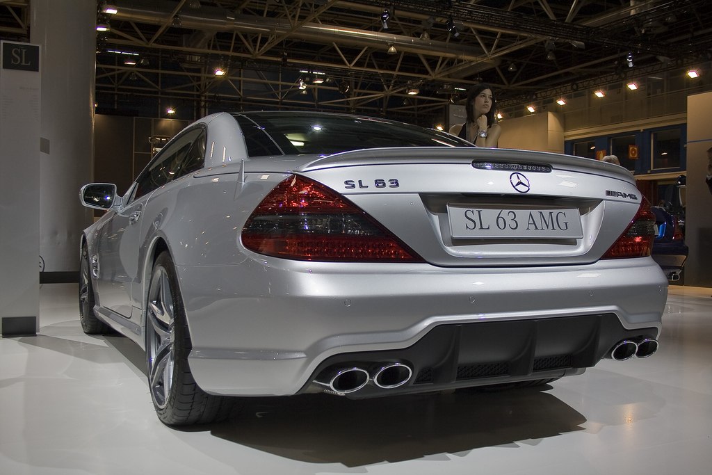 Silver luxury coupe rear with quad exhaust and taillights