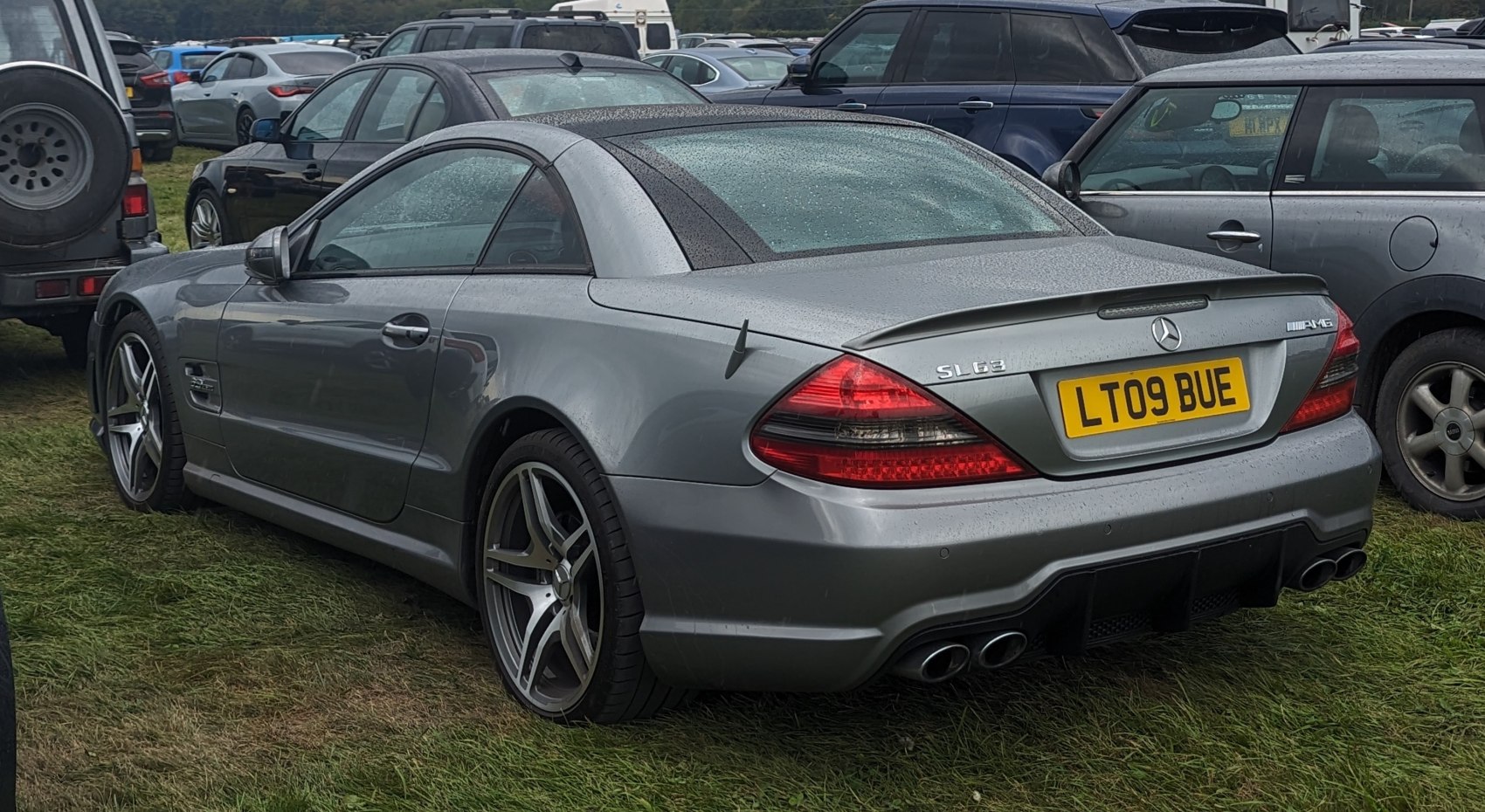 Rear view with quad exhaust and sporty coupe roofline