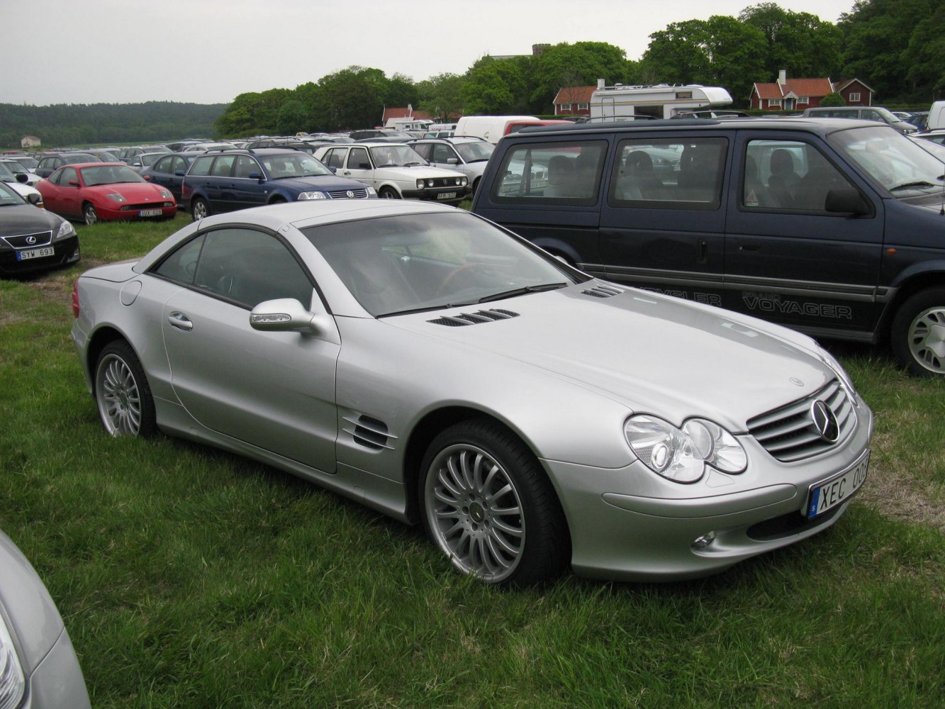 Silver coupe with front grille, alloy wheels and side vents