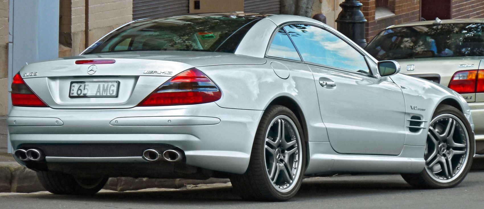 Rear view with quad exhaust and alloy wheels