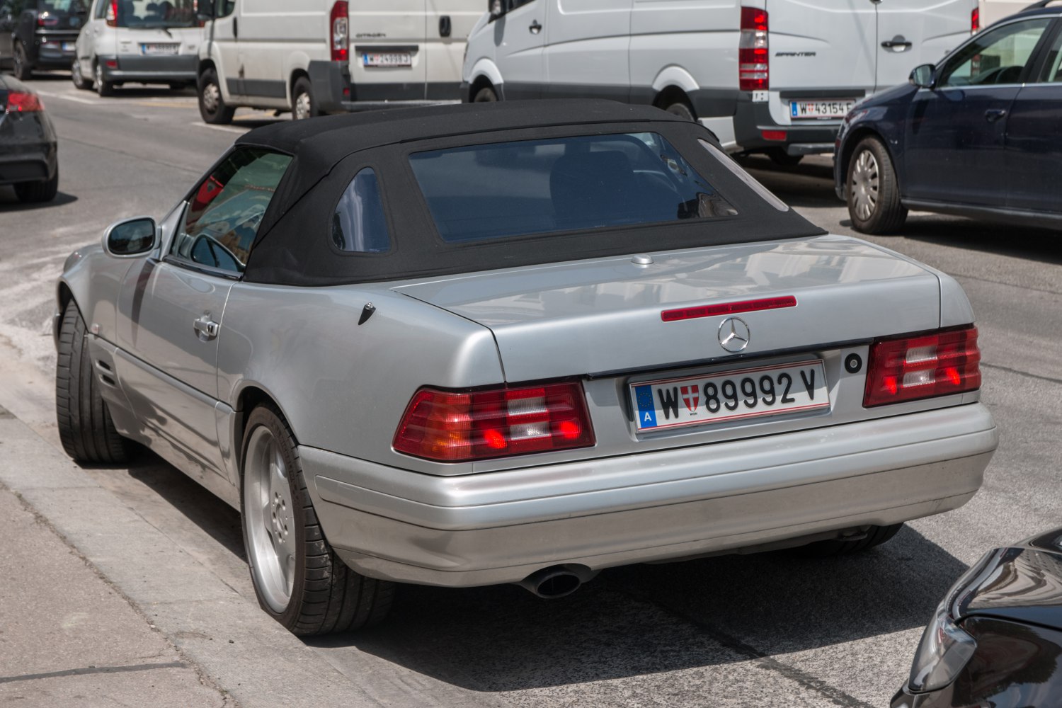 Convertible with black fabric soft top and rear taillights