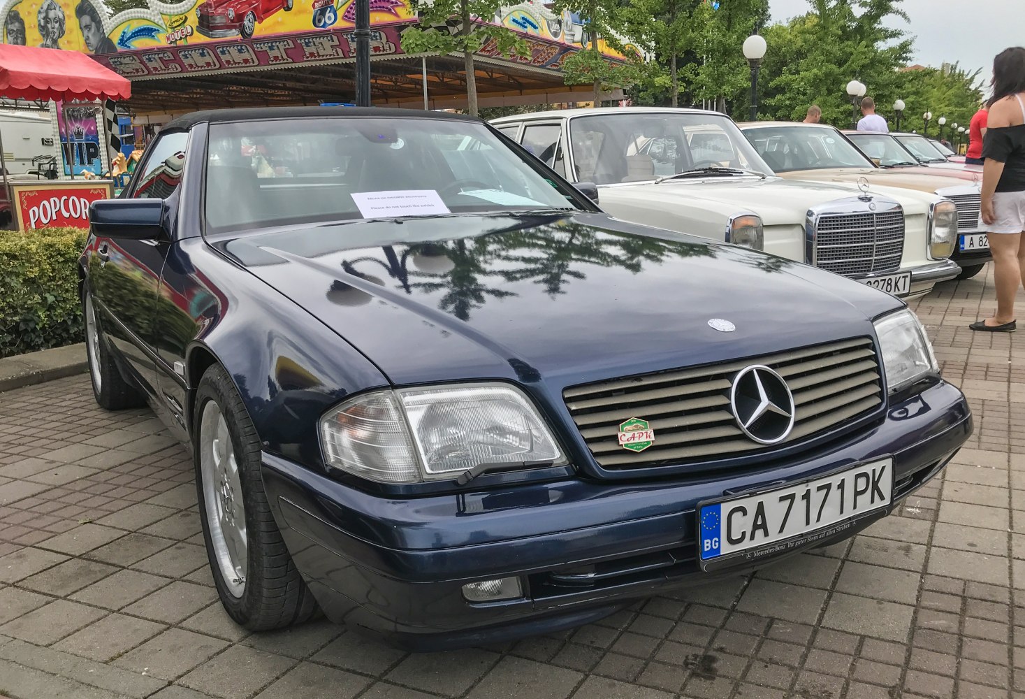 Close-up of front grille and headlight assembly with Mercedes emblem