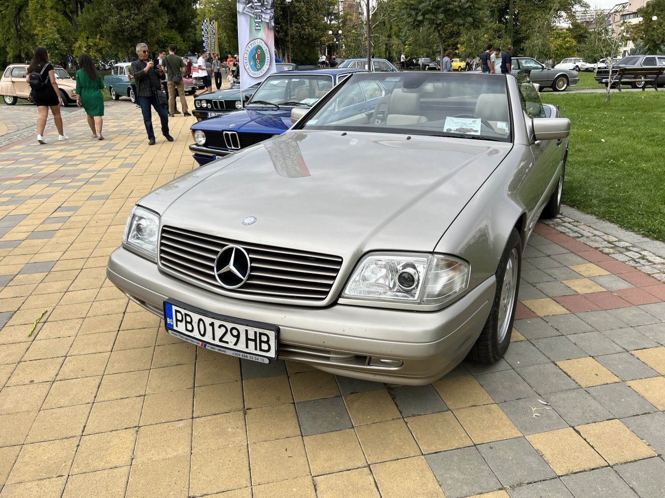 Front view of a classic convertible with signature grille and dual headlights