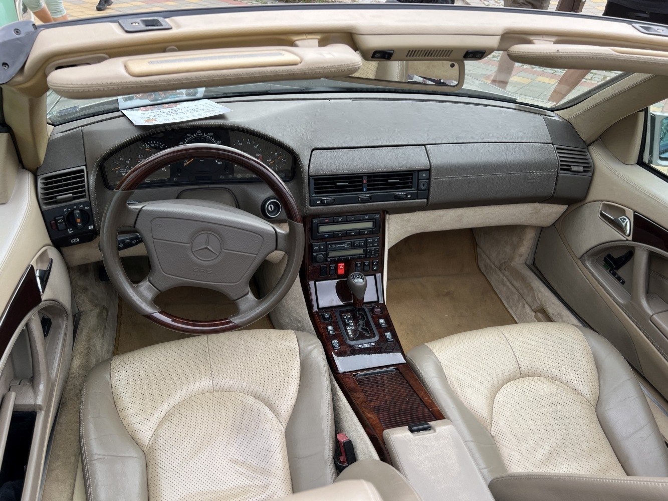 Dashboard, steering wheel, and center console of classic convertible interior