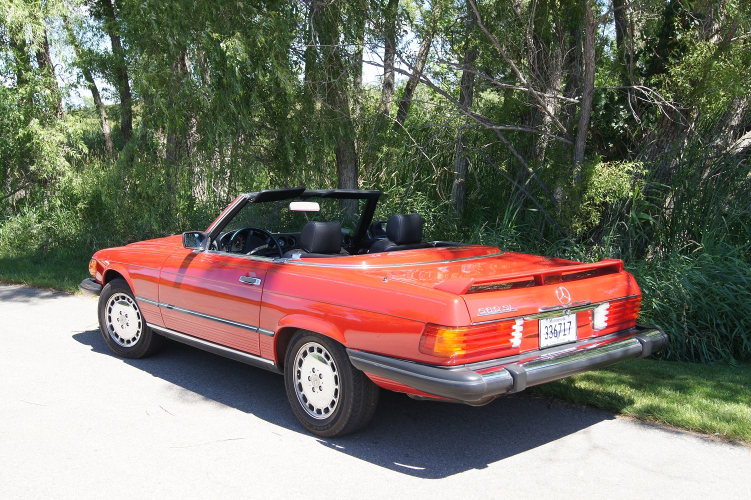 Convertible roadster with rear spoiler and alloy wheels