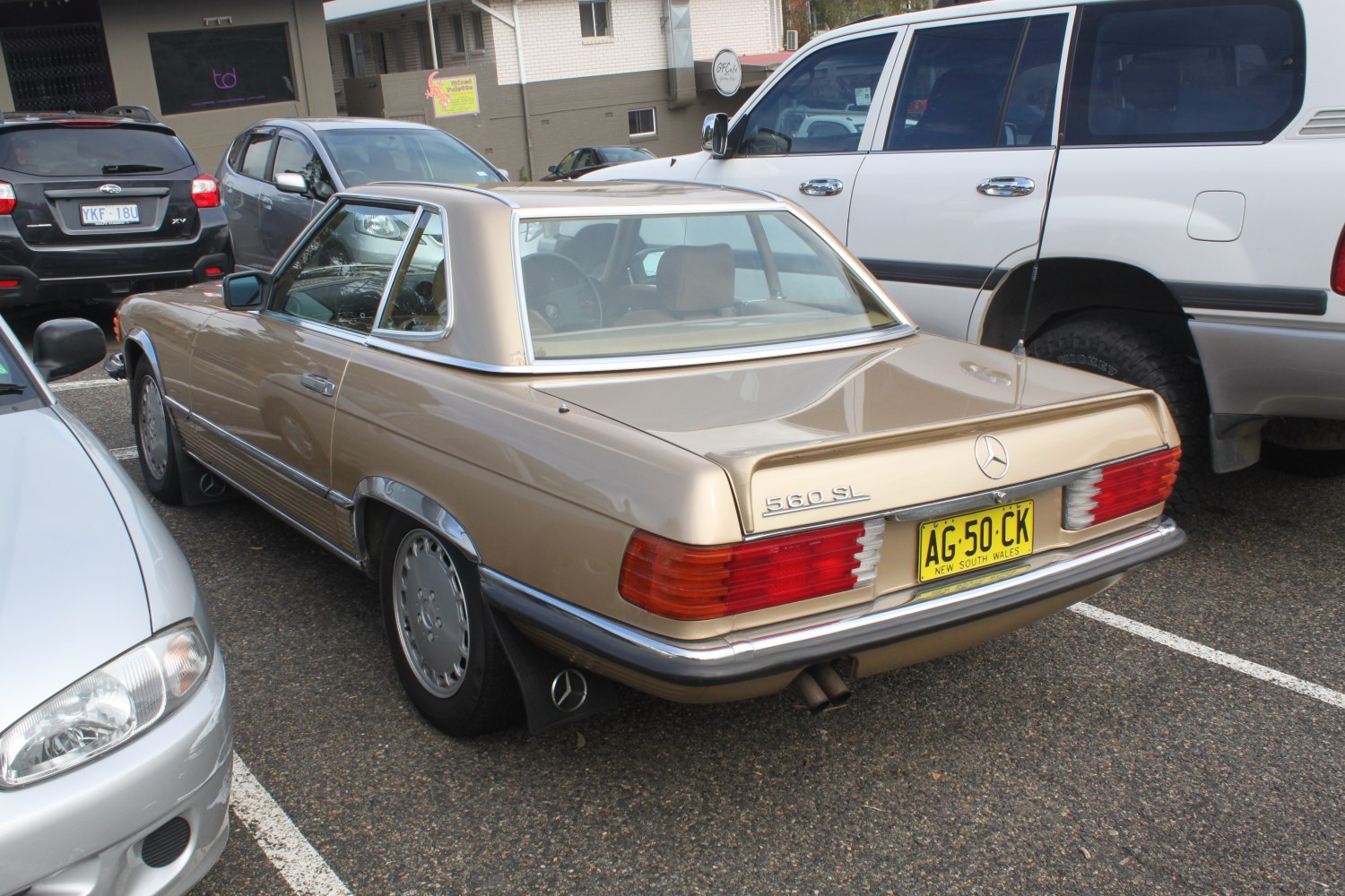 Rear view of classic 1985 coupe with distinctive tail lights and hardtop.