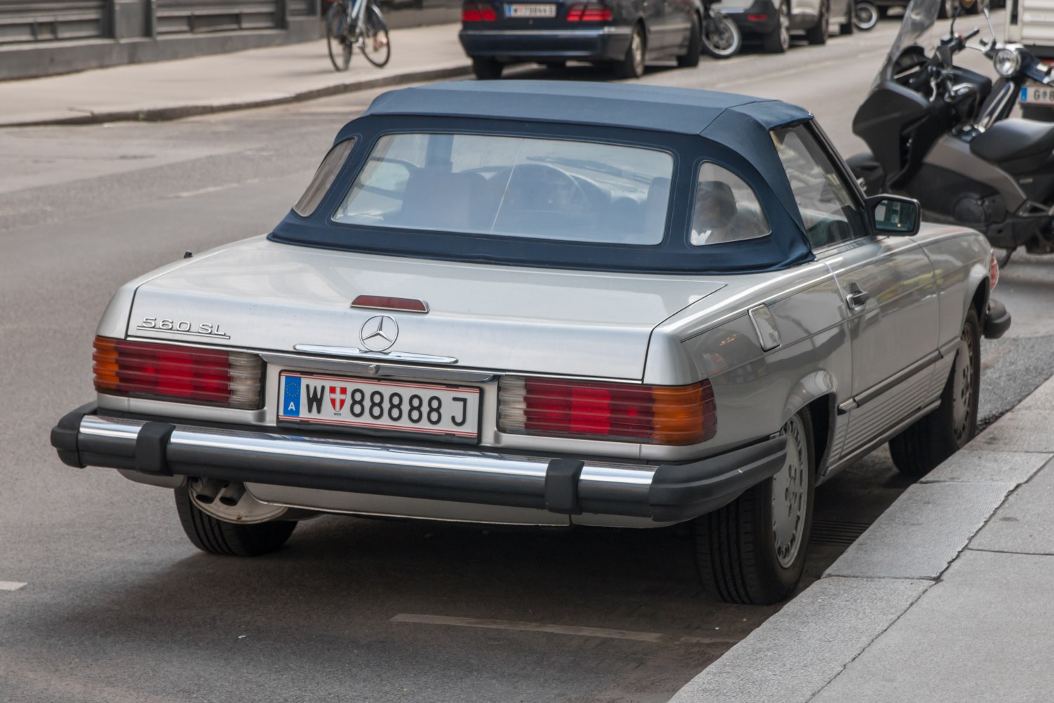 Rear view of vintage convertible with soft top and classic taillights