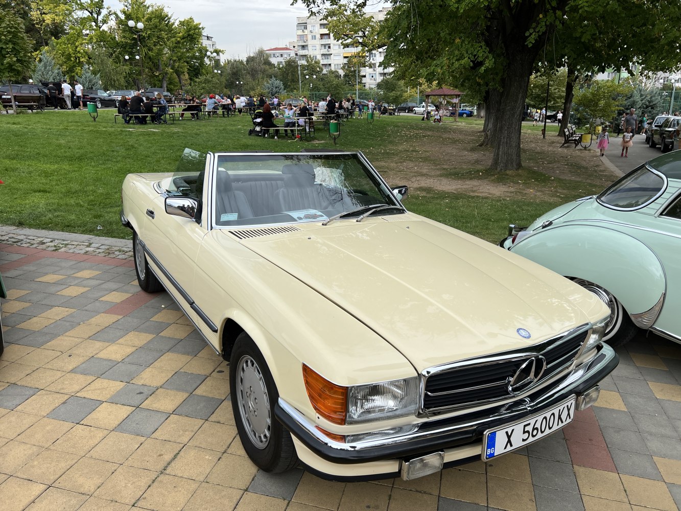 Beige classic convertible with distinctive front grille and smooth design