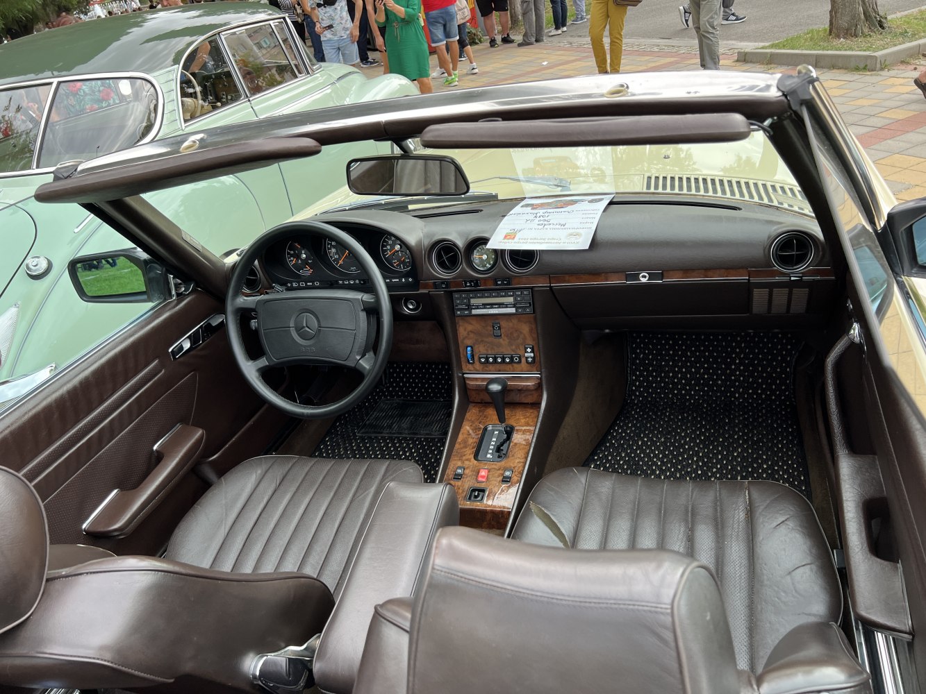 Classic vintage car interior with leather seats and wooden dashboard