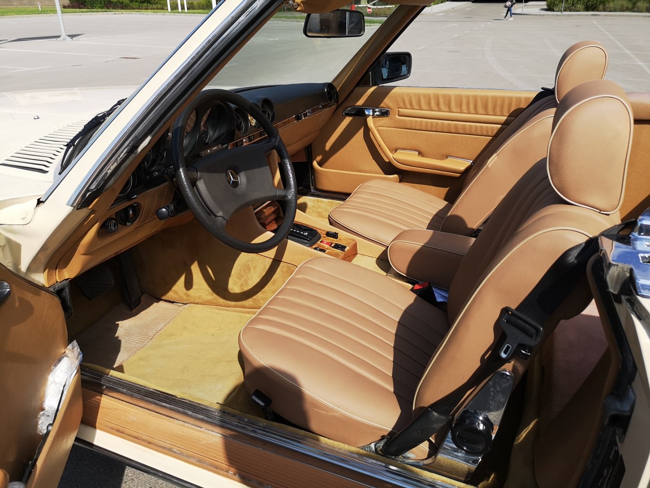 Vintage beige leather seats and classic dashboard design