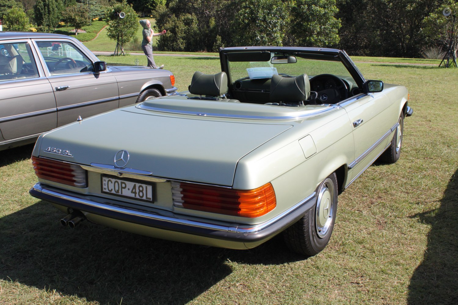Rear view of classic convertible with prominent tail lights and chrome trim