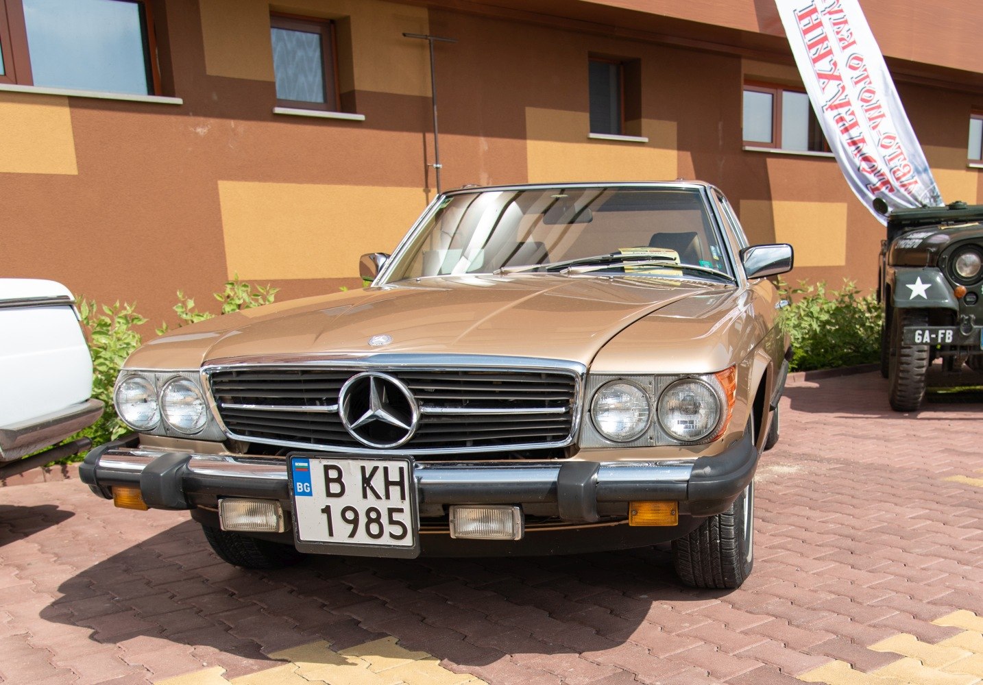 Front view with chrome grille and dual round headlights