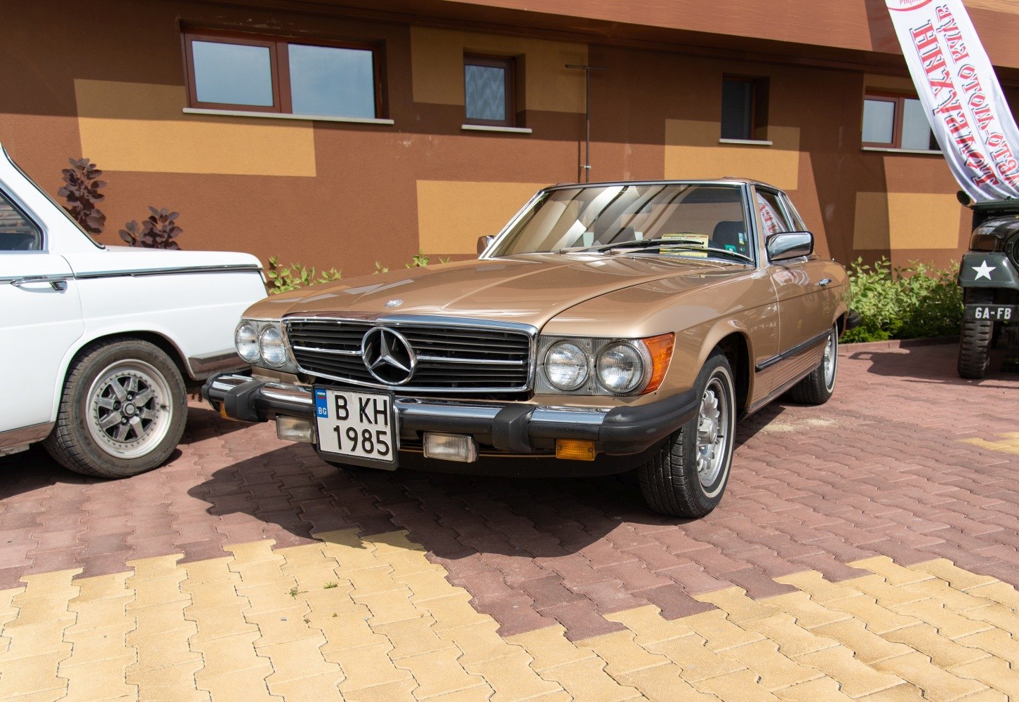 Front view with chrome grille, dual round headlights, and polished bumper.