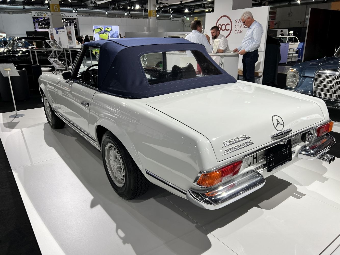 Convertible with blue fabric soft top and classic rear design