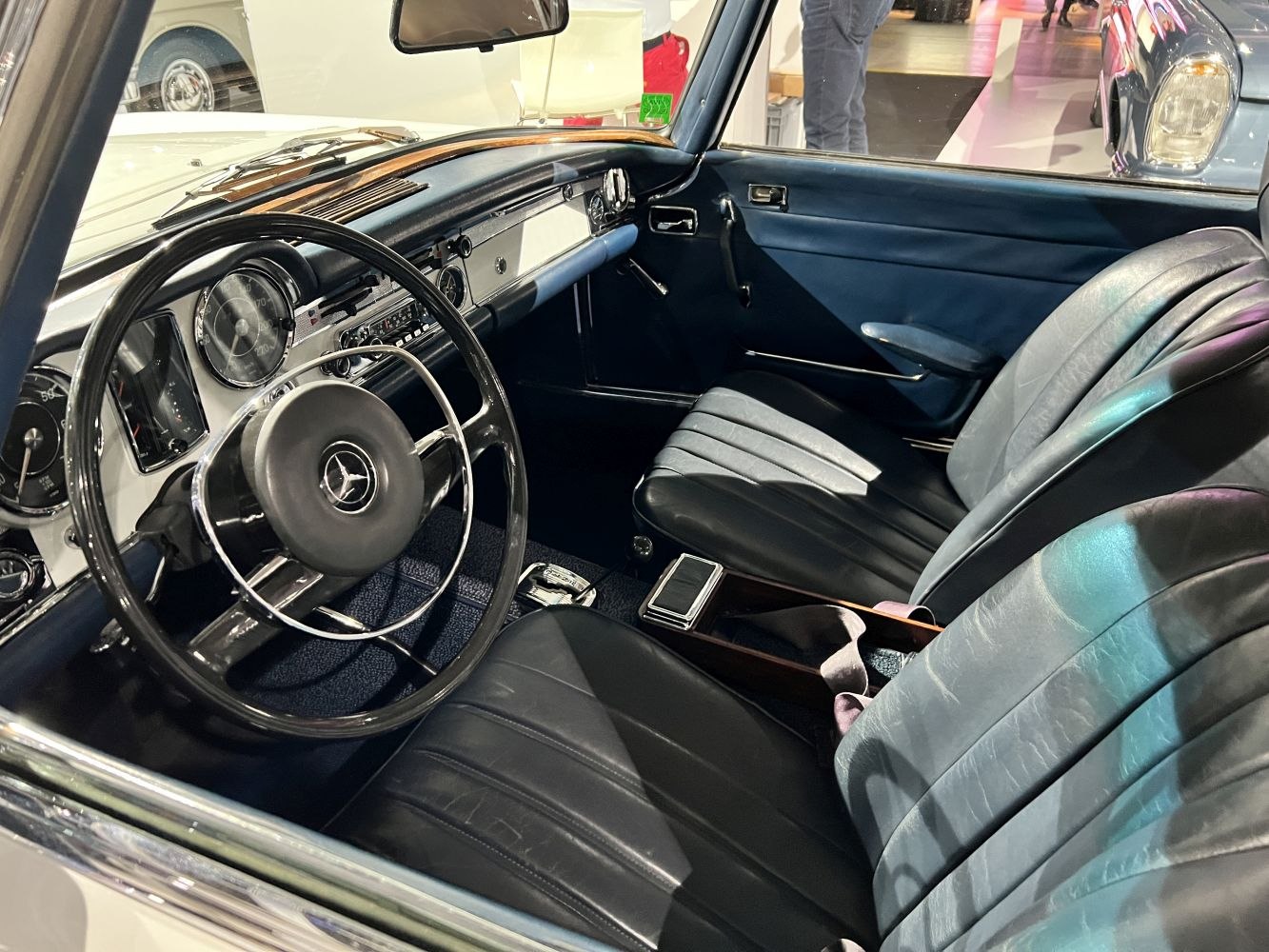 Classic car interior with vintage steering wheel and leather seats