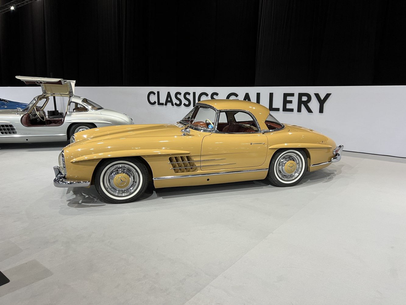 Vintage gullwing hardtop coupe with side vents and chrome wheels