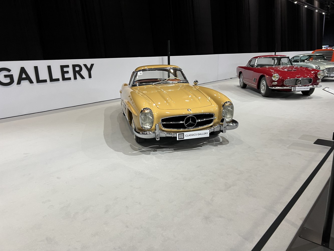 Vintage hardtop roadster with iconic front grille and round headlights