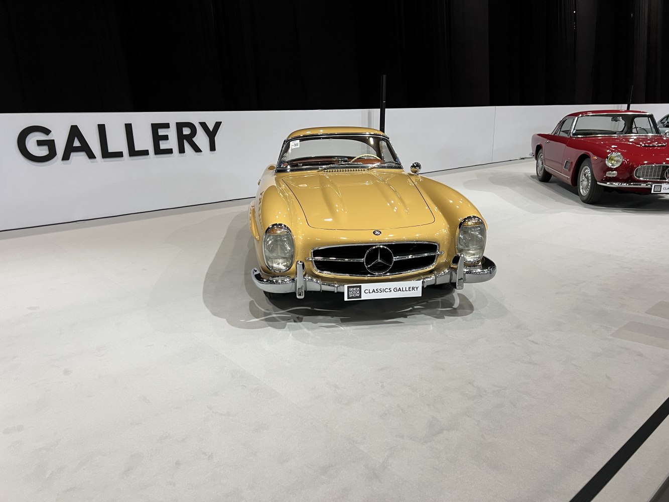 Vintage hardtop roadster with distinctive front grille and rounded headlamps