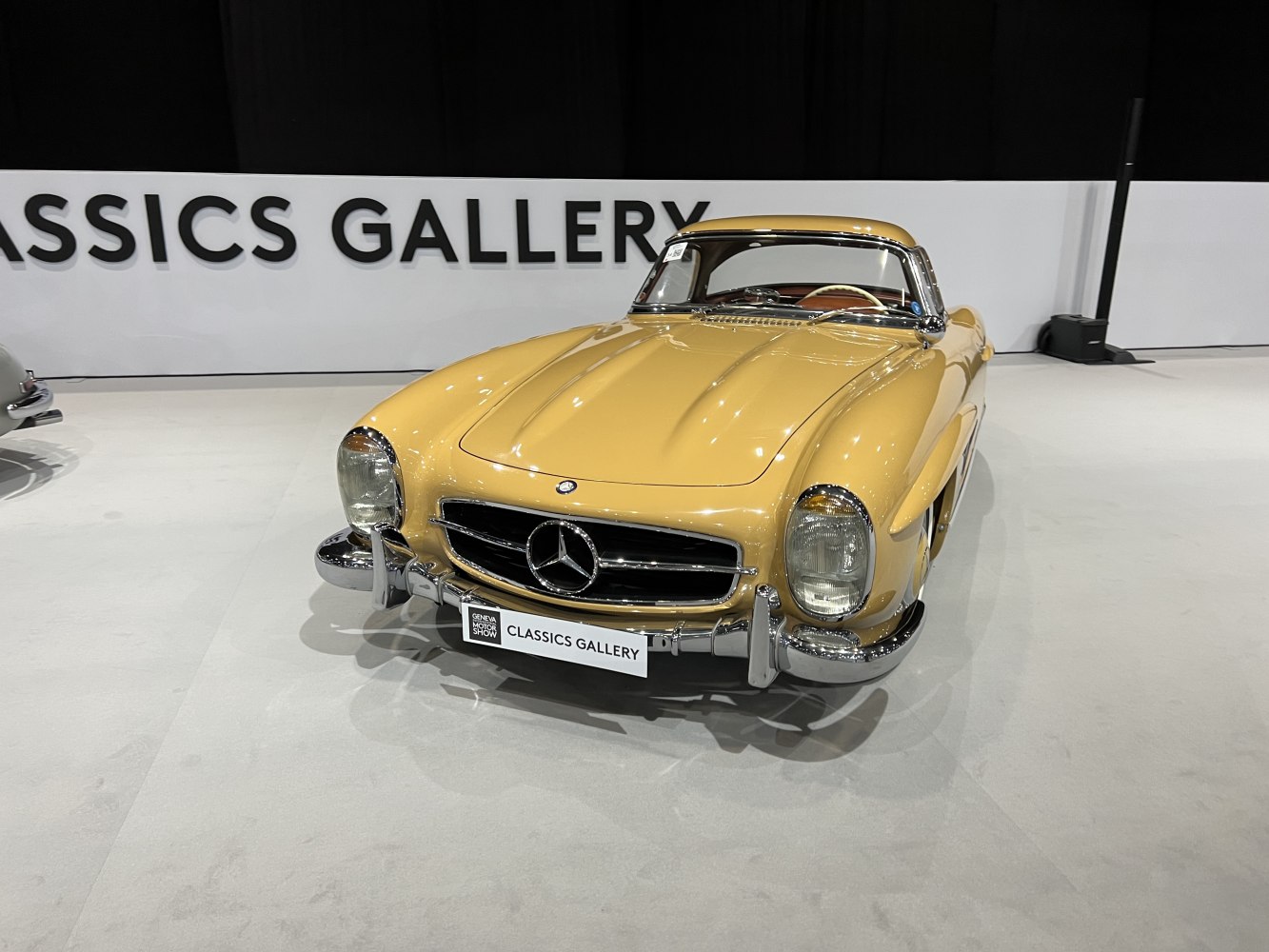 Front view of classic roadster with hardtop and chrome bumper
