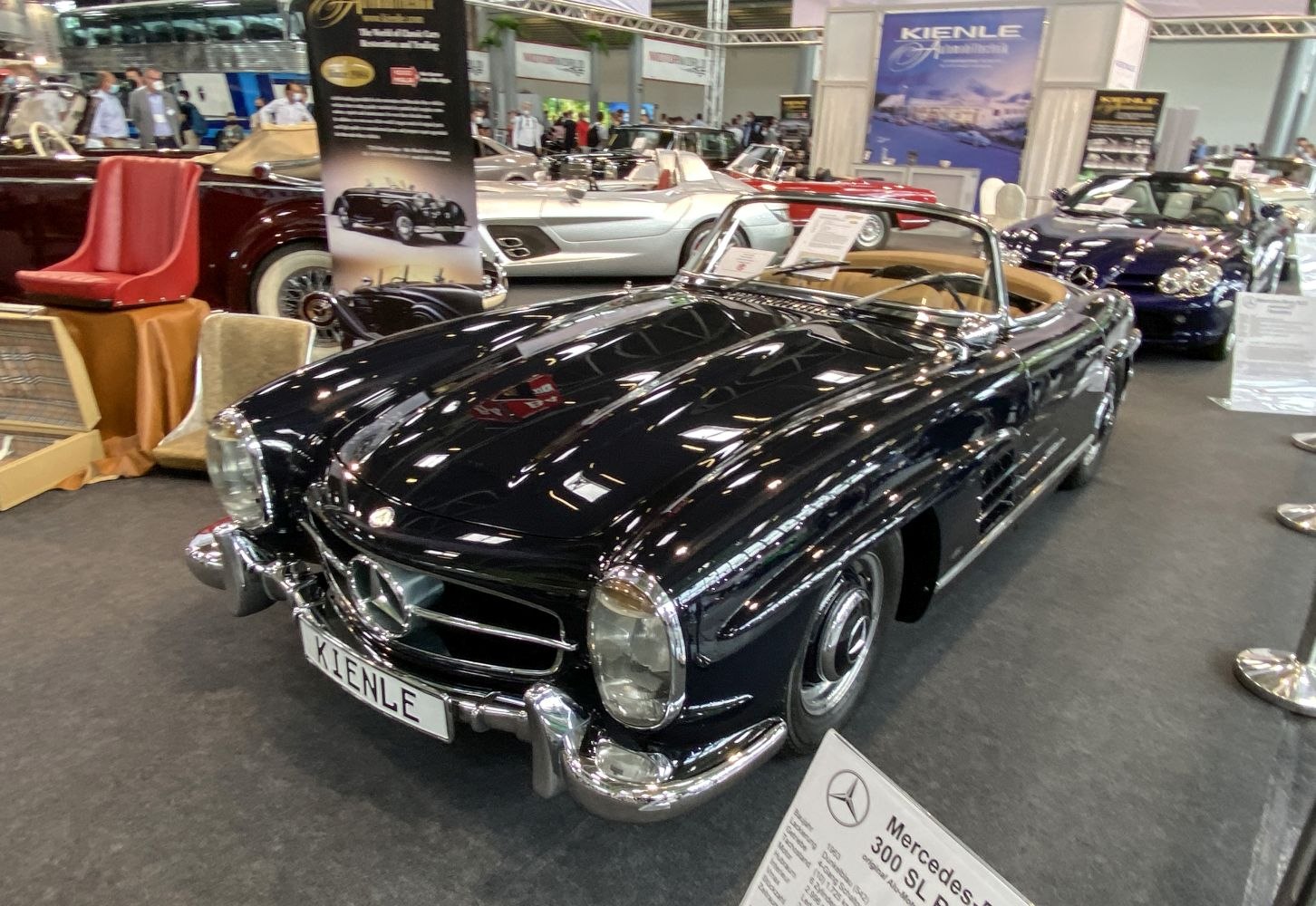 Glossy black vintage convertible roadster with chrome detailing