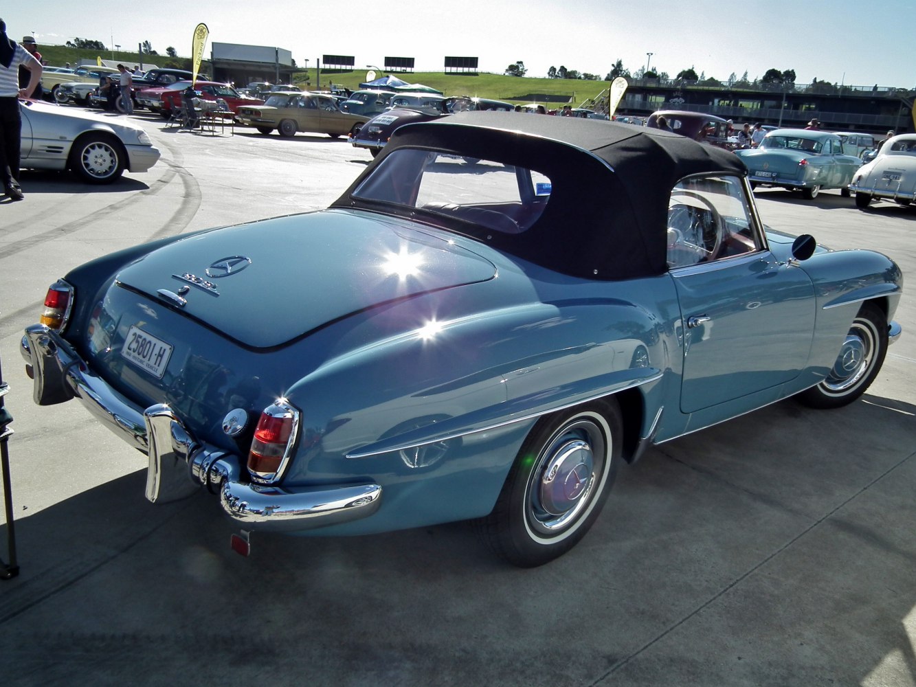 Vintage convertible with soft top and classic chrome bumpers