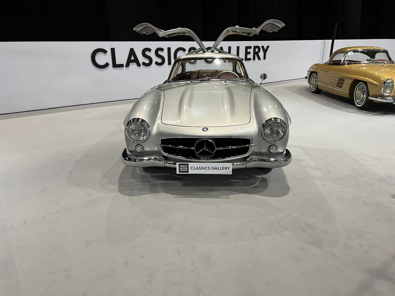 Vintage coupe with gullwing doors and round headlights