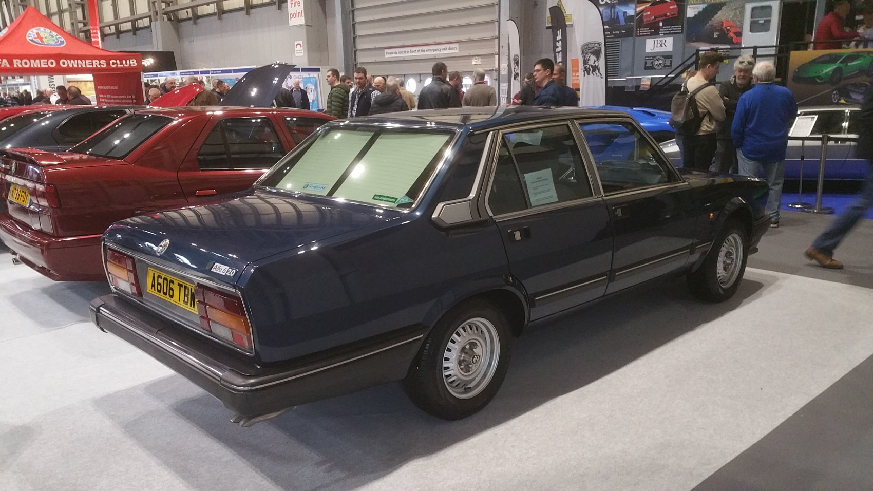 Rear side view of vintage sedan with distinctive tail lights