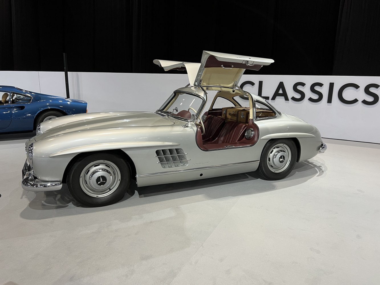 Classic coupe with iconic gullwing doors and vintage luxury interior.