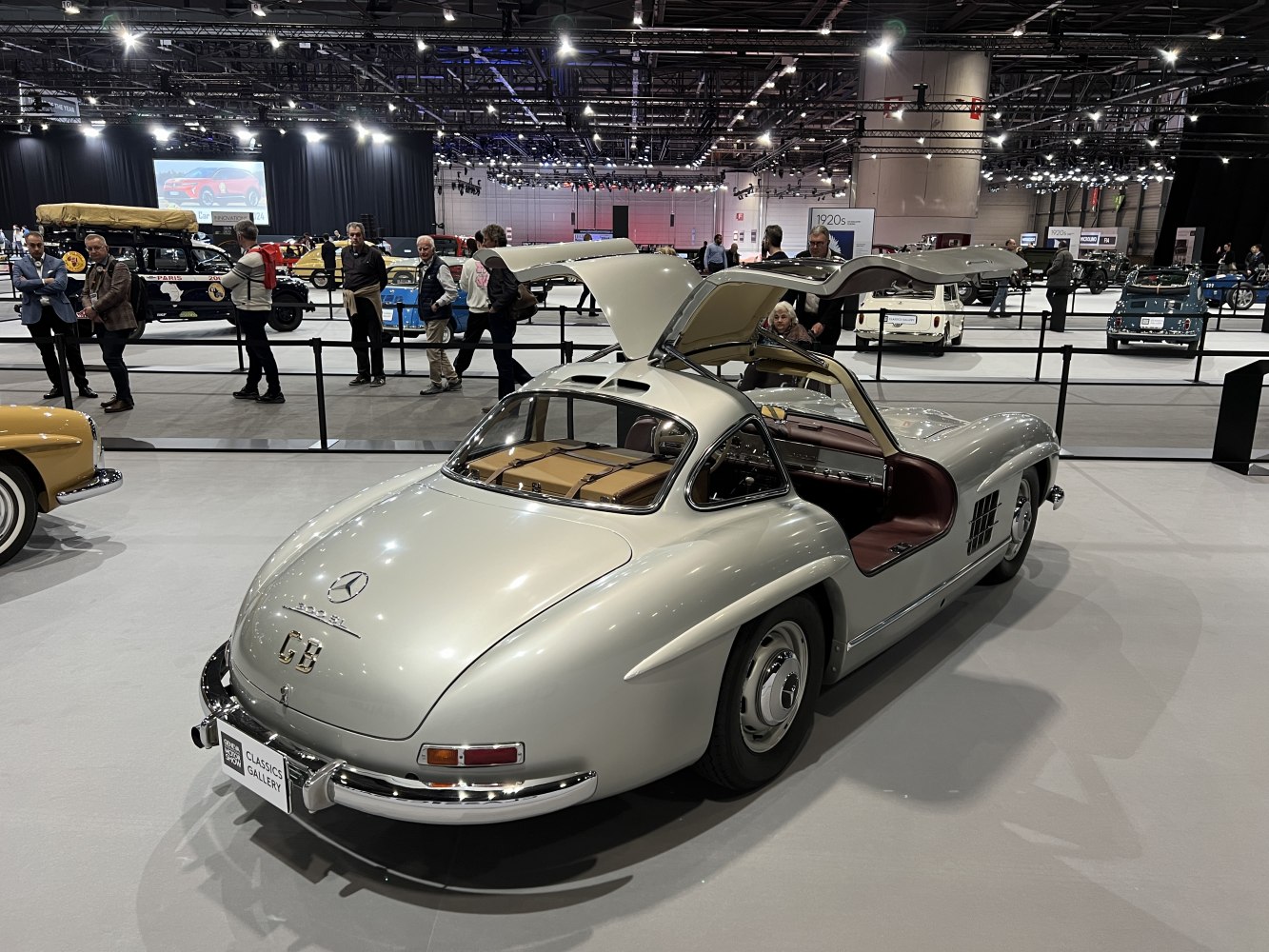 Classic silver coupe with unique gullwing doors open