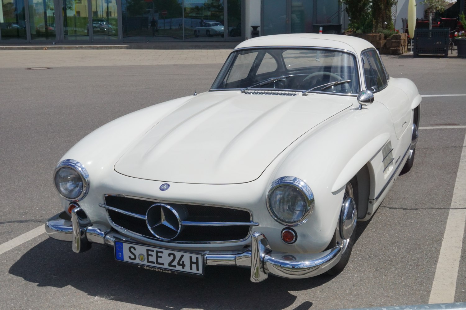 Vintage two-door coupe with rounded headlights and chrome grille