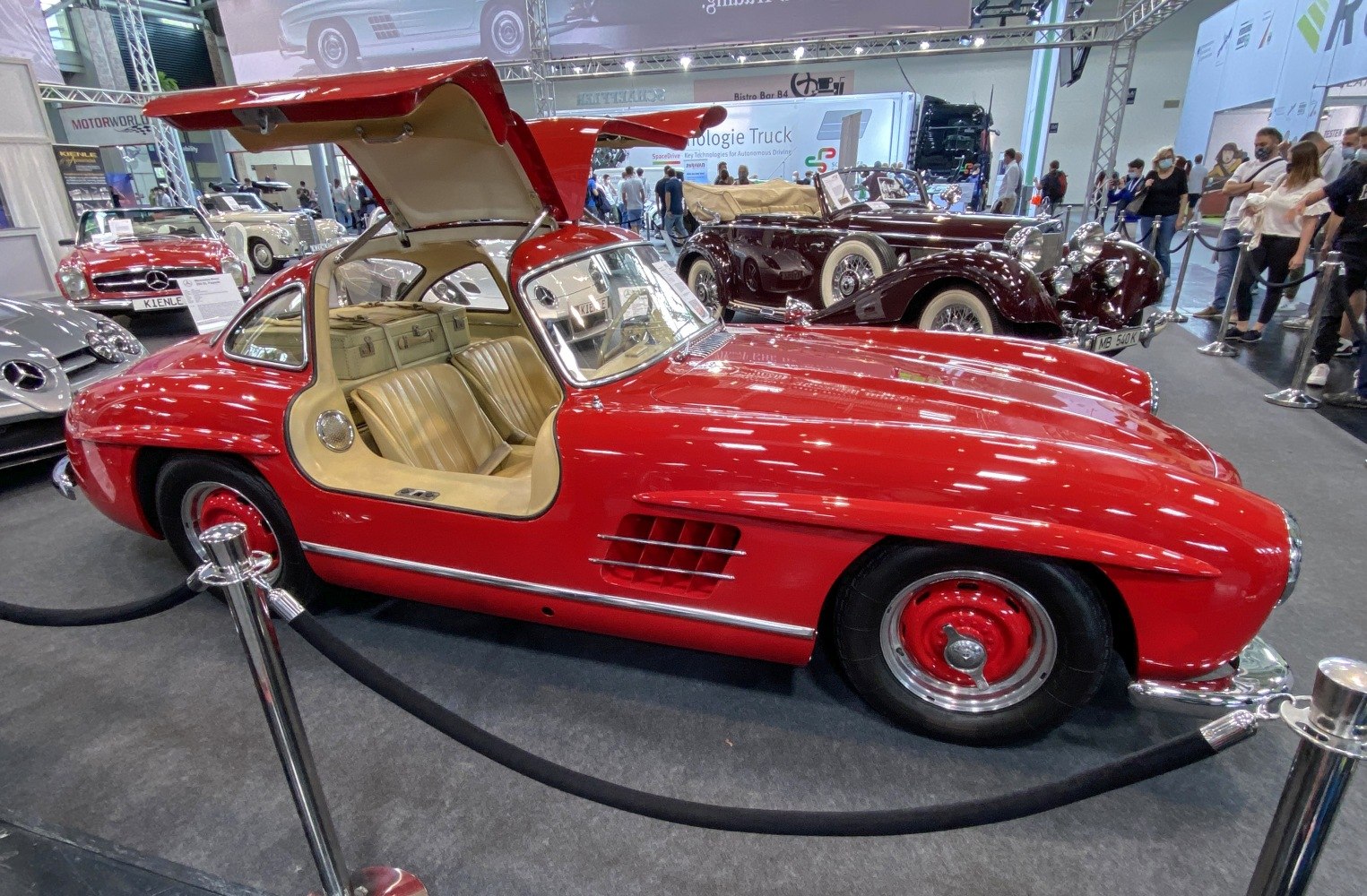 Red vintage coupe with gullwing door open and classic interior