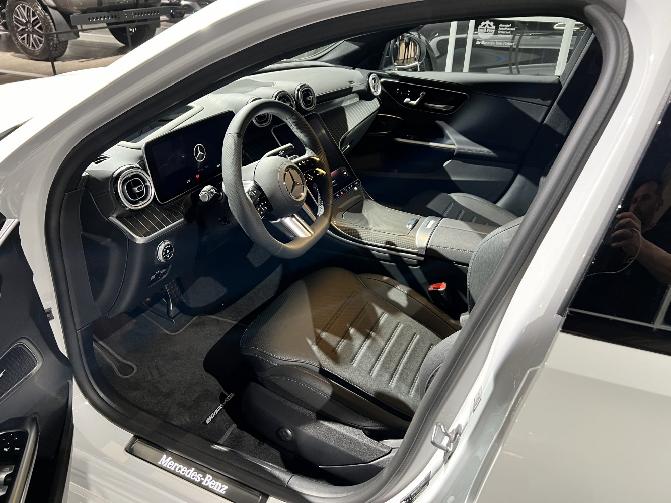 Modern car interior with digital displays and premium materials