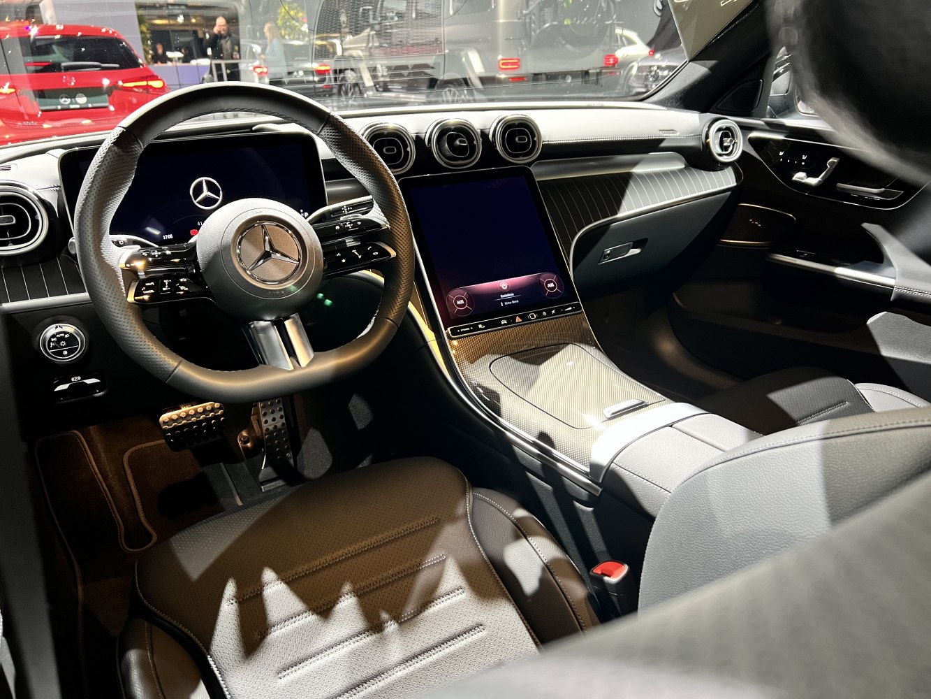 Luxury interior with touchscreen, steering wheel controls, and sleek design