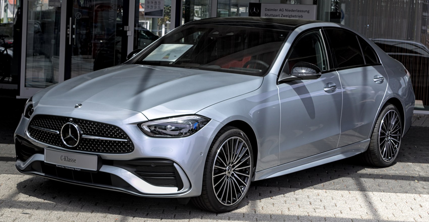 Luxury sedan front with distinctive grille and LED headlights