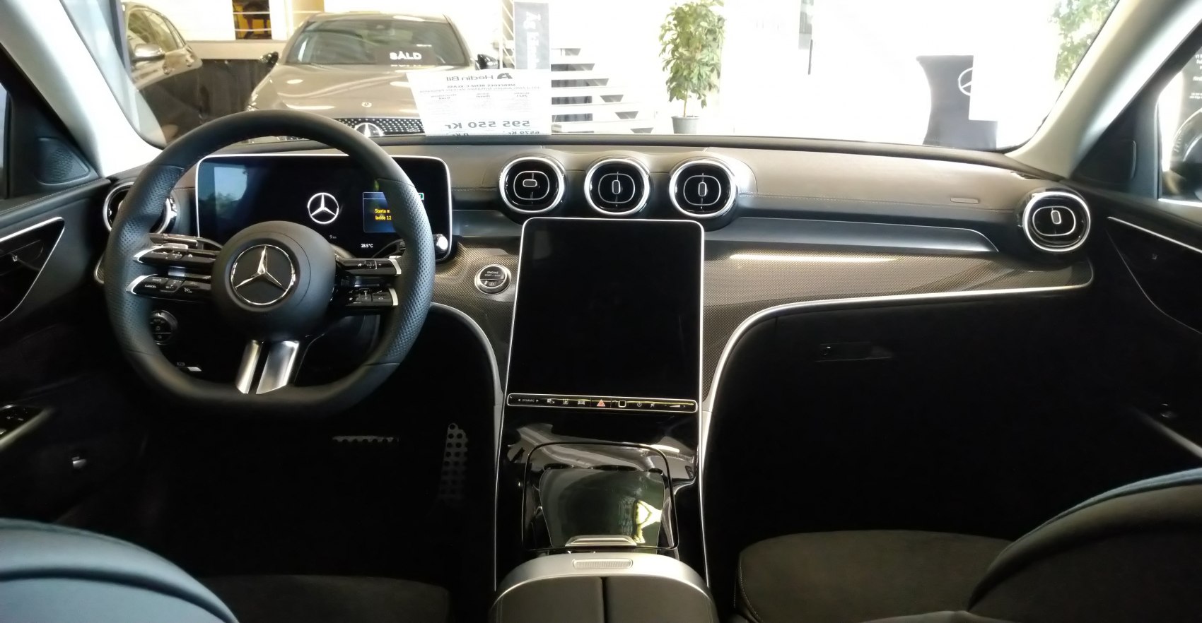 Digital dashboard, touchscreen center console, sporty steering wheel