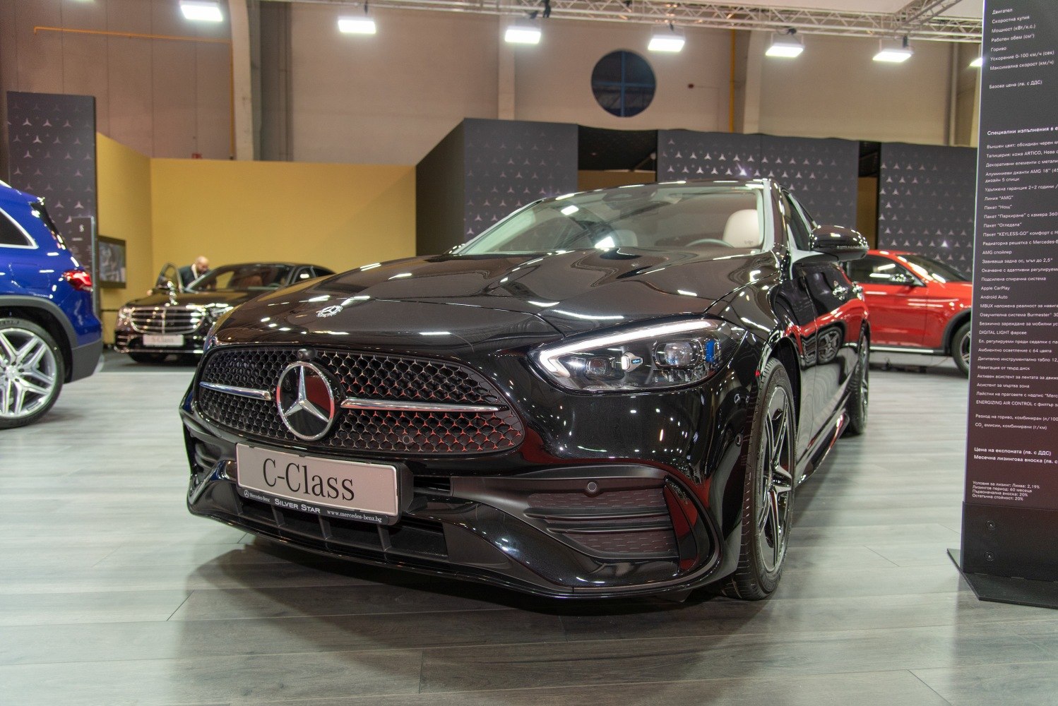 Close-up of luxury sedan's front grille and LED headlights