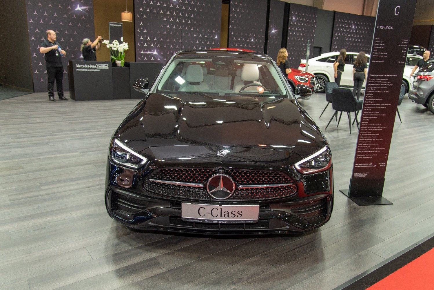 Front view showing grille and headlights of modern luxury sedan