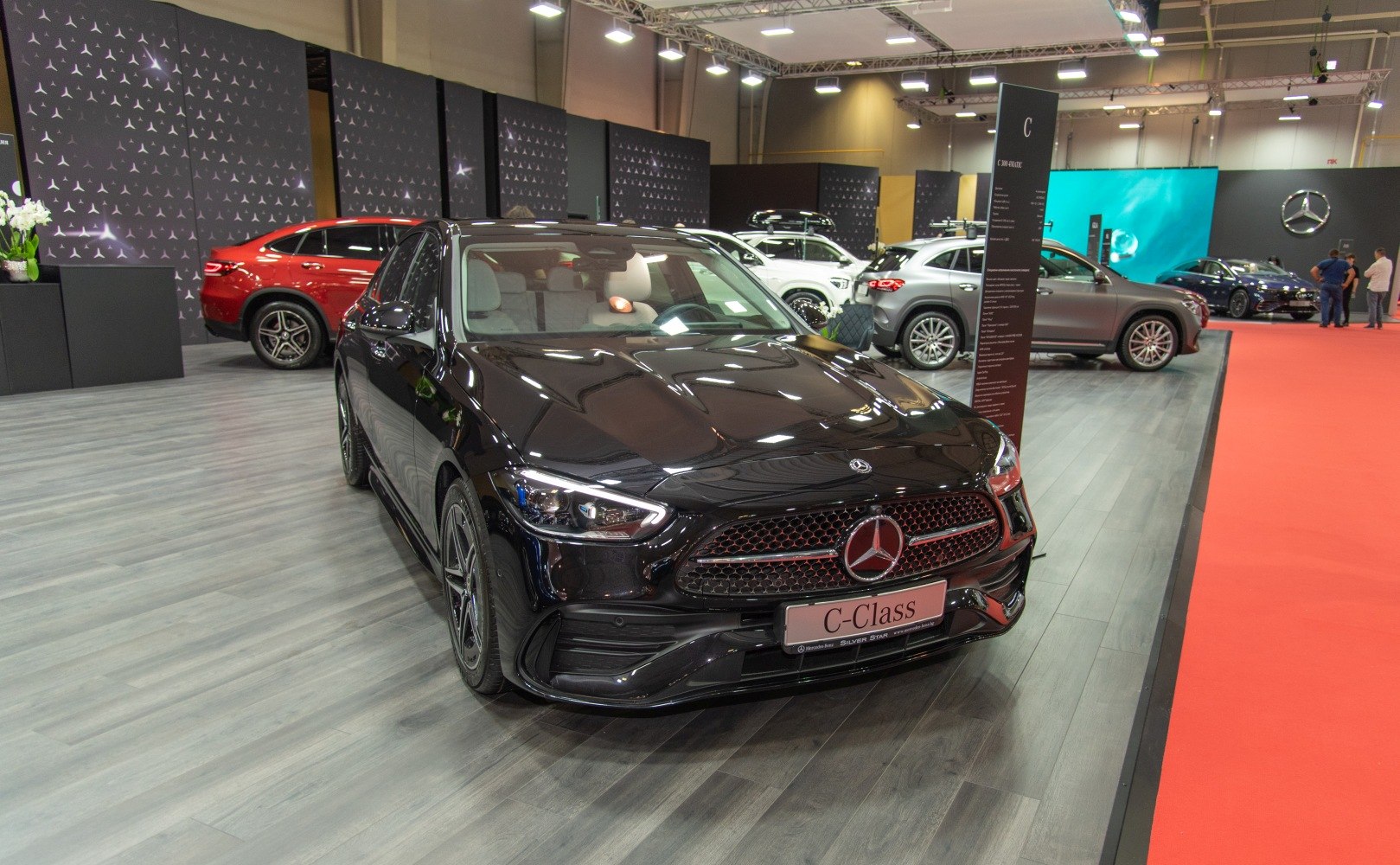Front view with sleek headlights and distinctive grille