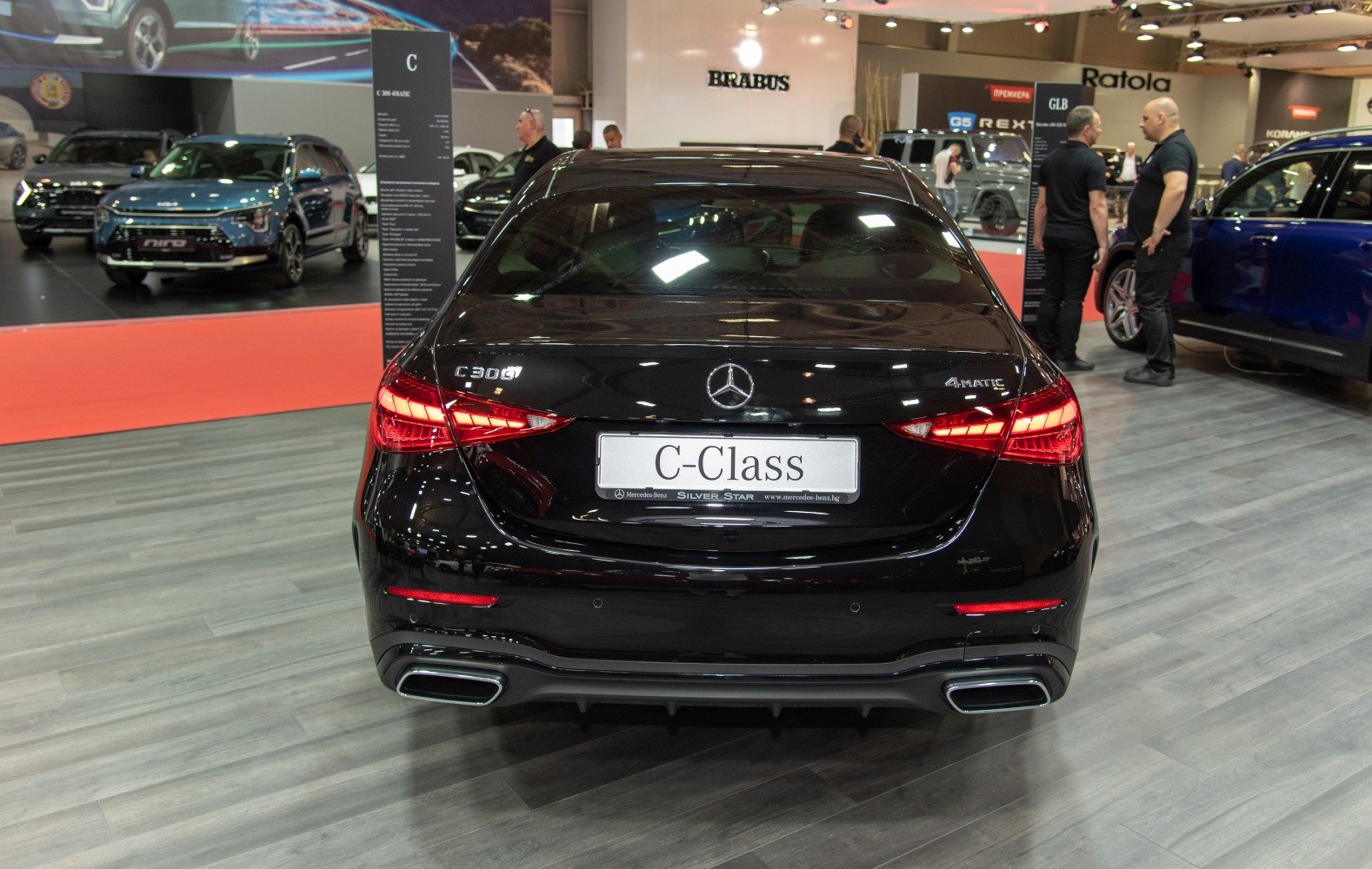 Rear view of luxury sedan with LED tail lights and dual exhausts