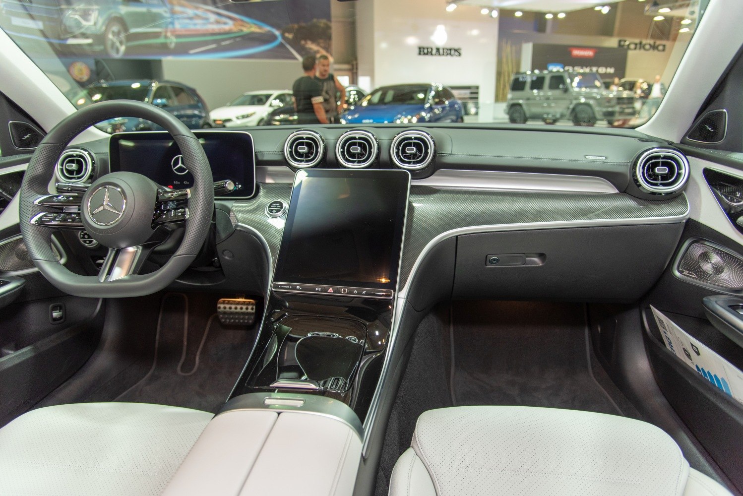 Dashboard with digital displays and circular air vents