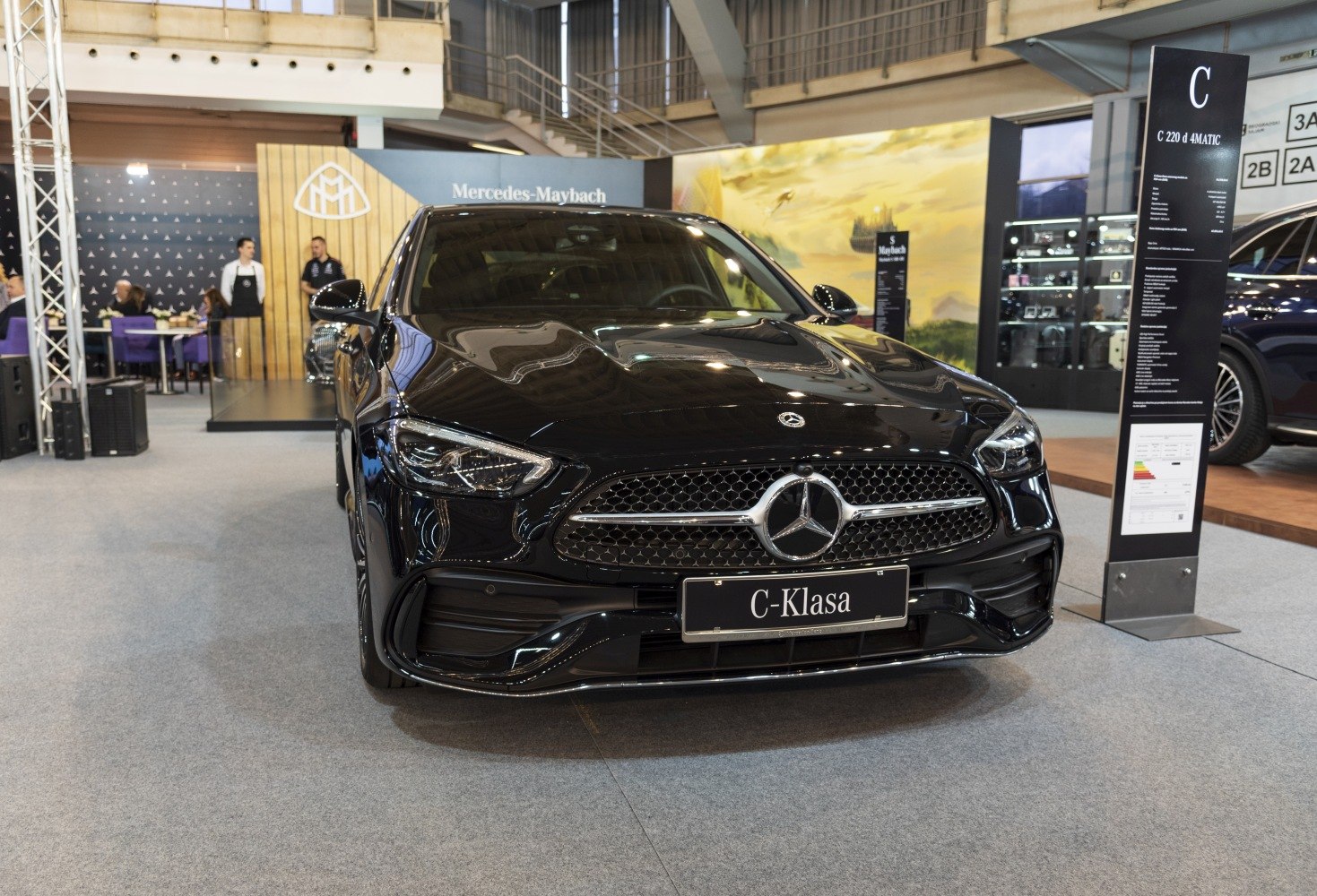 Front view of luxury sedan with diamond grille and modern LED headlights
