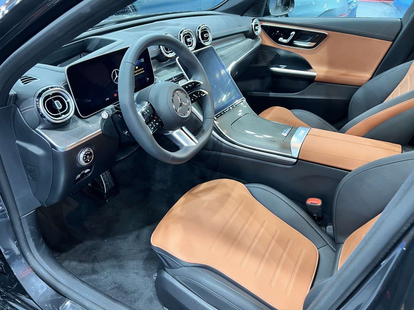Dashboard, digital displays, air vents, two-tone leather seats