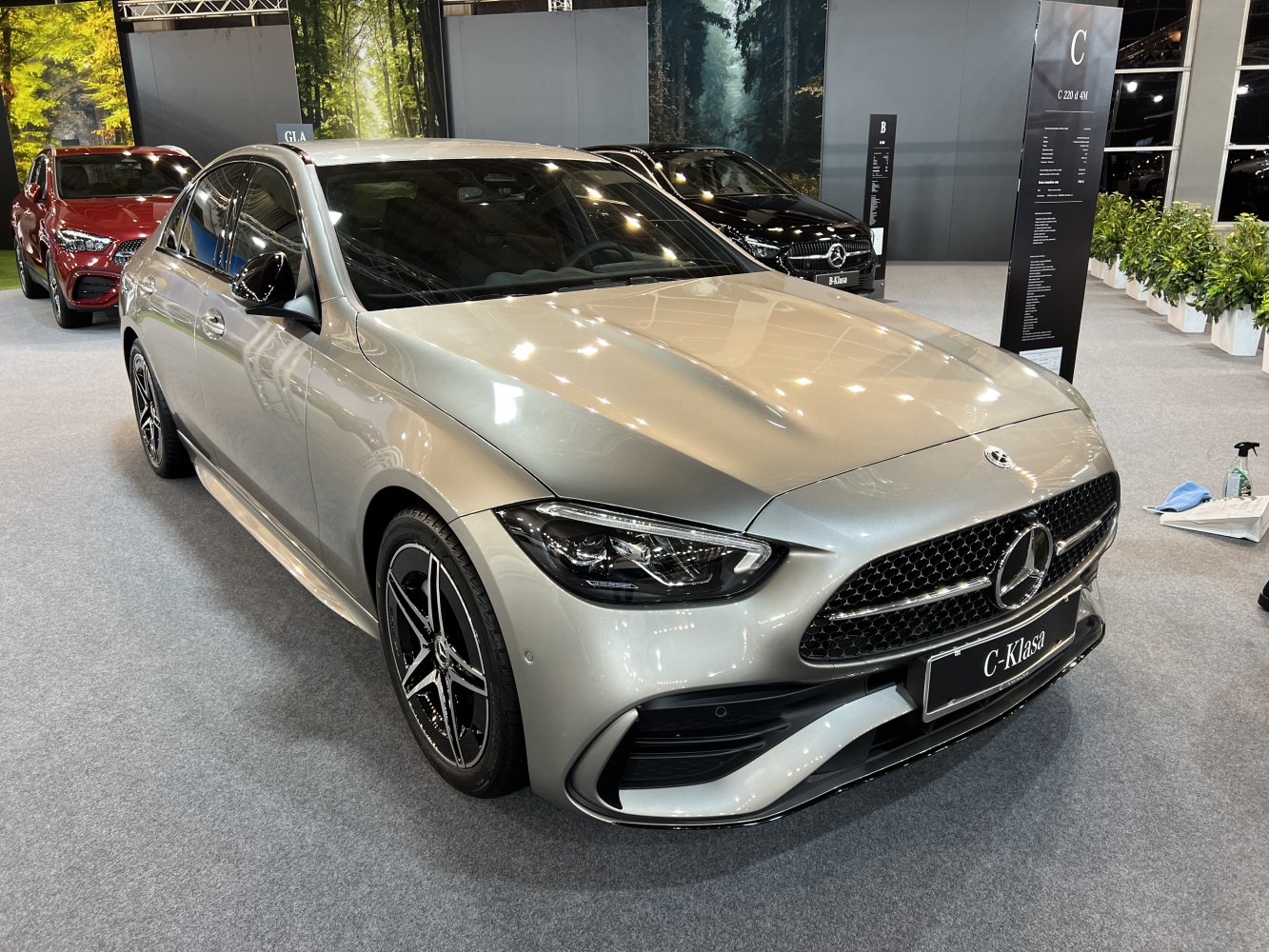 Modern front grille and alloy wheels in a silver sedan
