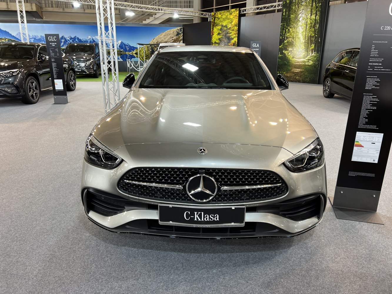 Front view of modern luxury car with prominent grille and headlights