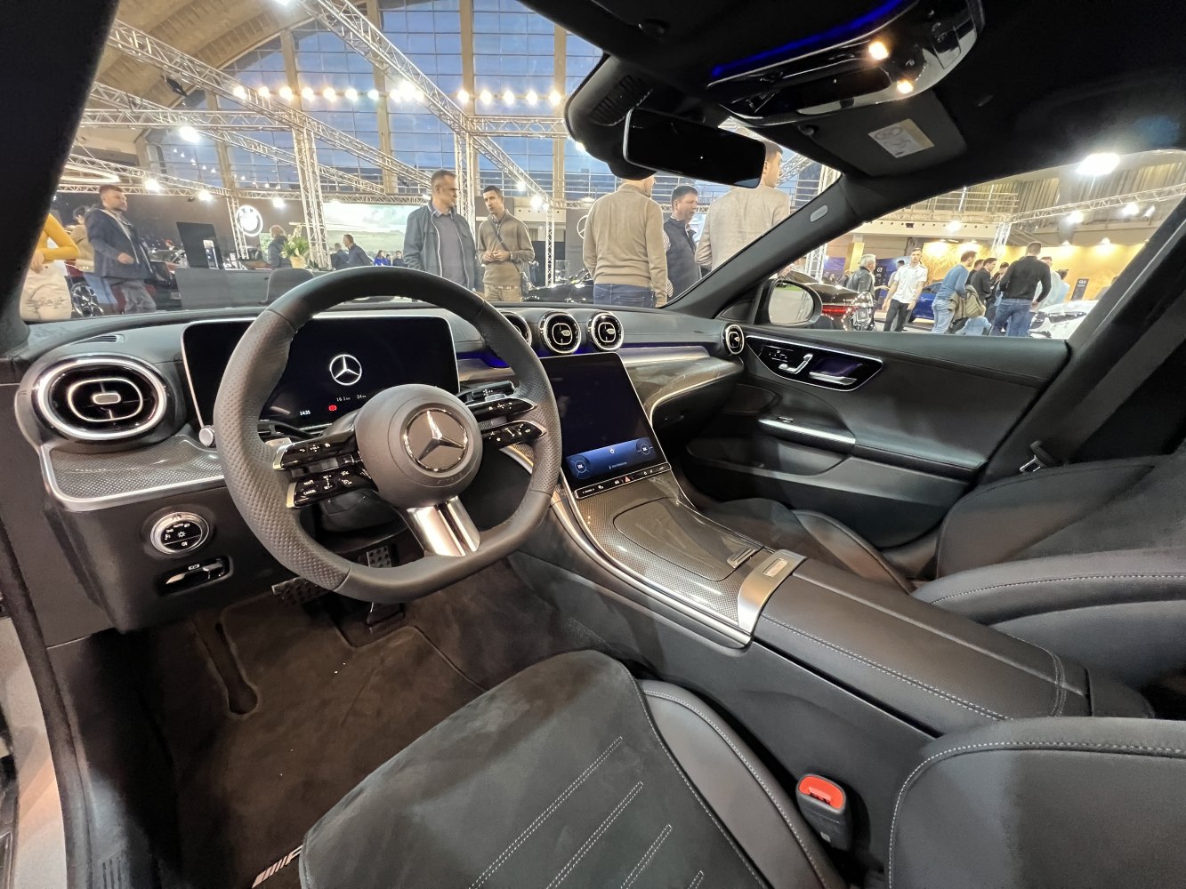 Modern dashboard and steering wheel with digital displays and air vents